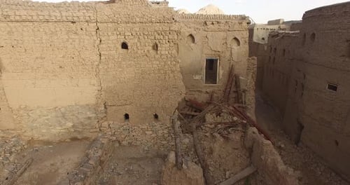 A Village Surrounded By Walls, Made of Soil.