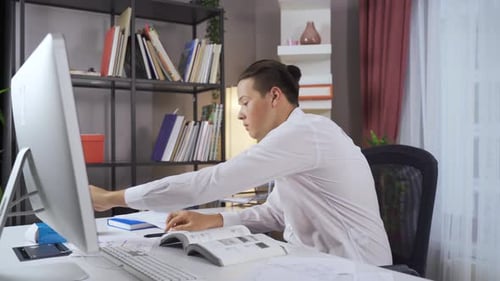 Working at the desk.