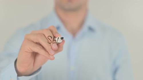 Writing Self Made Millionaire on Glass Screen