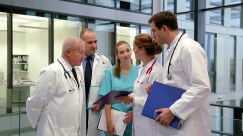 Medical Professionals Meeting in Modern Hospital Setting