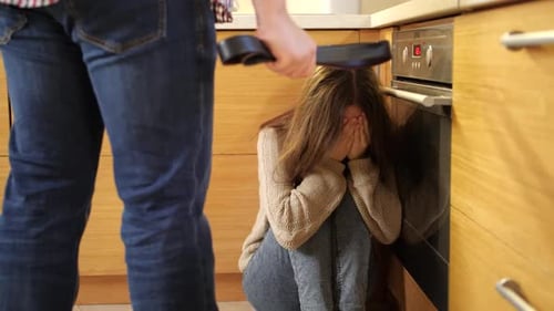 Angry Father Holding Leather Belt and Threats Crying Daughter Sitting on Floor