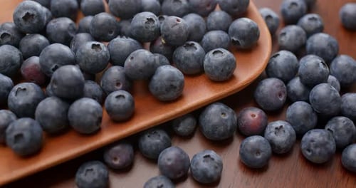 Close-Up of Fresh Blueberries on Wooden Table