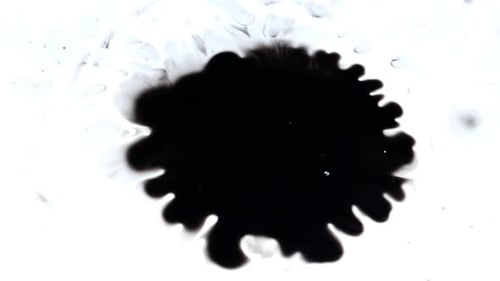 Abstract Black Ink Spreading on White Background