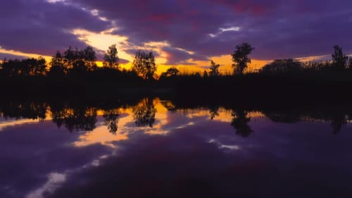Golden Lake Reflecting the Colorful Sunrise