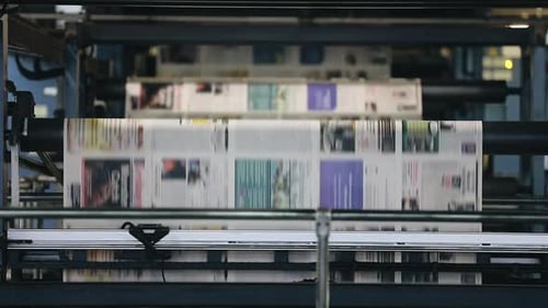 Industrial Printing Press Churning Out Newspapers at High Speed