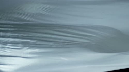 Abstract Translucent Fabric Flowing Against Black Background