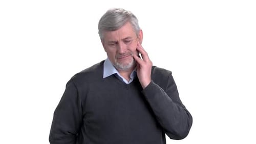 Man Holding His Face in Pain from Toothache