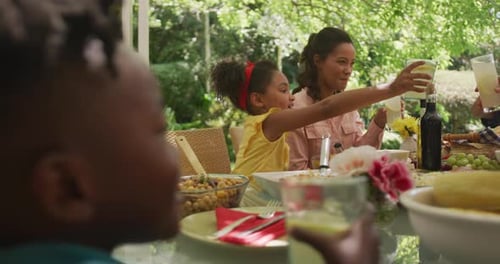 African American family spending time in garden together