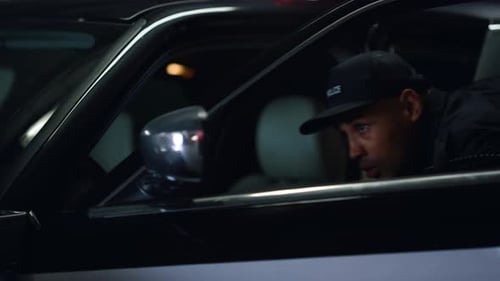 Police Officer Aims Pistol From Patrol Car At Night