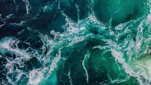 Waves of Water of the River and the Sea Meet Each Other During High Tide and Low Tide