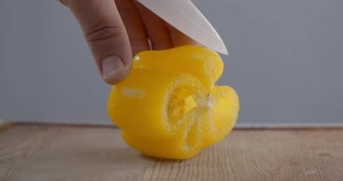 Cutting Yellow Bell Pepper with Ceramic Knife