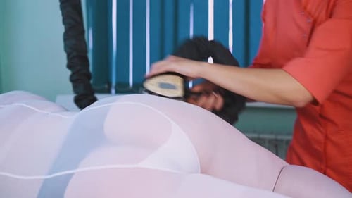 Woman Getting Buttocks Massaged at a Spa