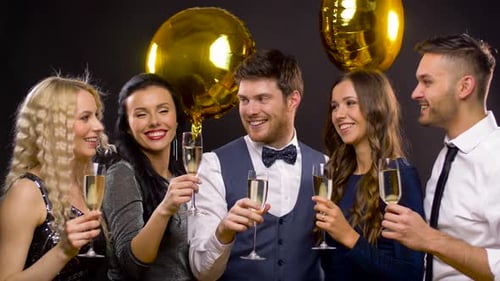 Five Smiling Friends Clinking Champagne Glasses Together