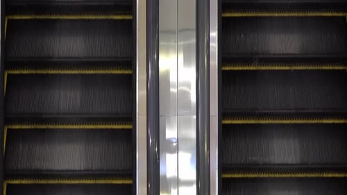 Modern Escalator Moving Upward in an Urban Setting