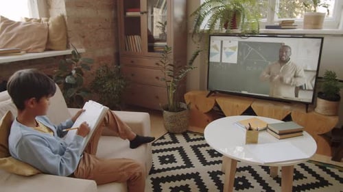 Boy Studying Math at Home with Online Teacher