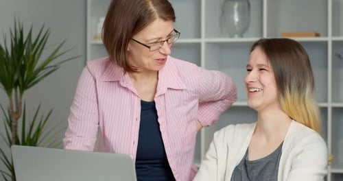 Two Females Working on Laptop Indoors