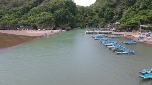 Aerial view of traditional boats in lagoon beach in Indonesia