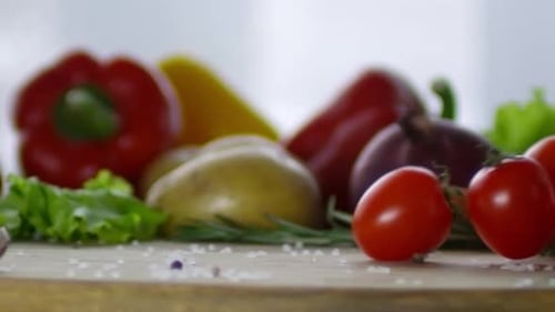 Fresh Vegetables and Herbs on Cutting Board