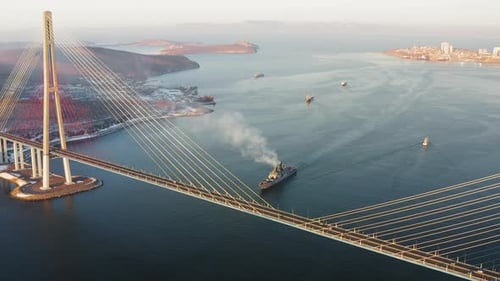 Russian Battleship Ship Passes the Strait Against the Background of the Bridge