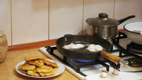 Frying Breaded Food Pieces in a Pan