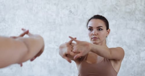 Reflection in Mirror of Woman Young Brunette Girl in Sportswear Doing Exercises in Morning Before