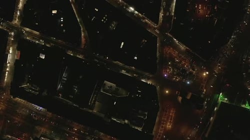 AERIAL: Slow Overhead Shot of City at Night with Lights and Traffic, Cologne, Germany