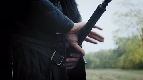 Close Up of the Warriors Belt While He Is Taking Out the Sword Out of the Sheath