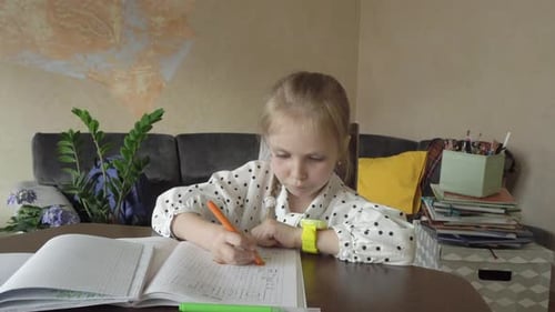 Young Girl Doing Homework and Drawing at Home
