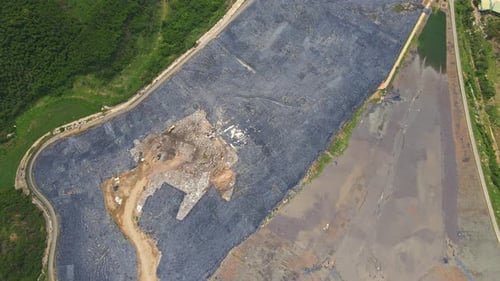 Aerial Top View Video of a Solid Waste Landfill. City Waste Treatment Location. Environmental