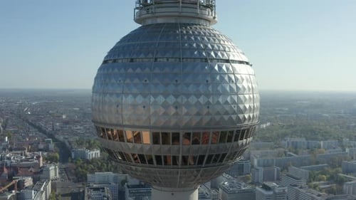 AERIAL: Super Close Up View of the Alexanderplatz TV Tower in Berlin, Germany on Hot Summer Day