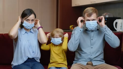 Family Wearing Face Masks at Home
