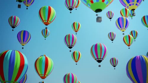 Bright Colorful Hot Air Balloons Floating Up in Blue Sky