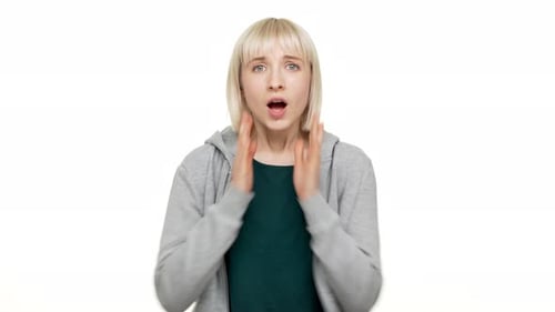 Woman Expressing Shock with Hands on Face