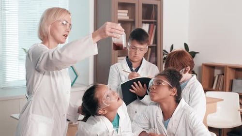 Kids Observe Science Experiment in Classroom
