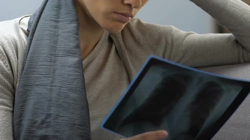 Cancer Patient Looking at Breast X-Ray Scan, Upset by Fatal Diagnosis, Closeup
