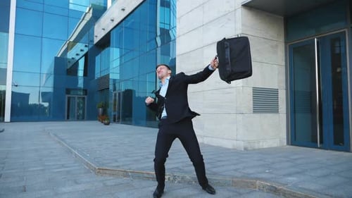 Young Happy Businessman in Suit Rejoices at Good Deal on City Street. Successful Office Worker