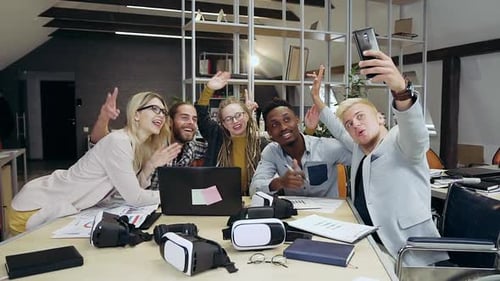 Young Office People Making Selfie while Working Together in Contemporary Office Room