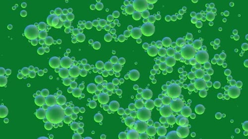 Oil green drops moving in water