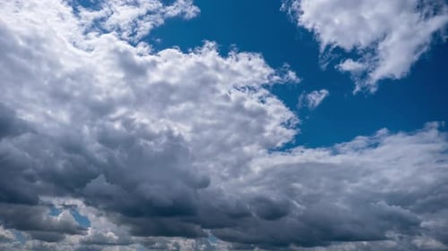 Dramatic Clouds Time Lapse Against Blue Sky