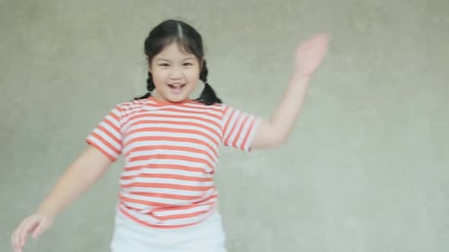 Happy Child Dancing Indoors