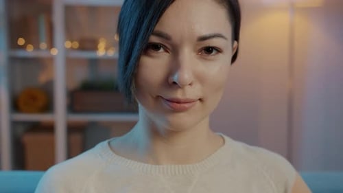 Young Woman Smiling in Close-Up Portrait