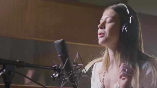 Beautiful Female Singer Working in Music Studio