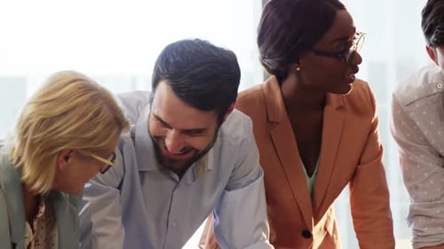 Diverse Team Collaborating in Bright Modern Office
