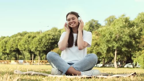 Listening to Music in Headphones in Park
