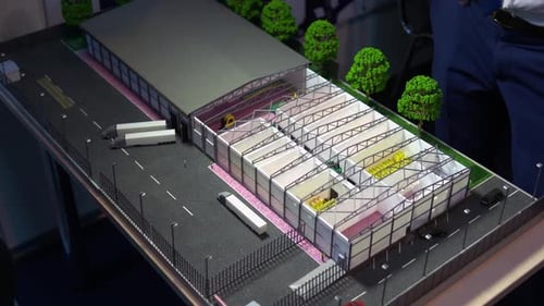Small Miniature Mockup of Warehouse with Trucks