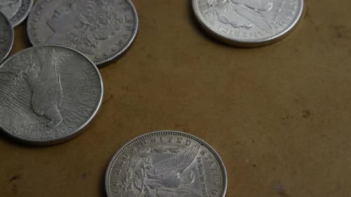 Rotating stock footage shot of antique American coins - MONEY 0059