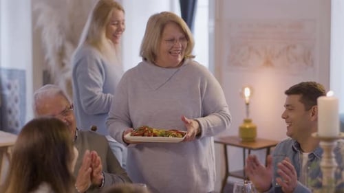 Family Gathering Together for a Meal at Home