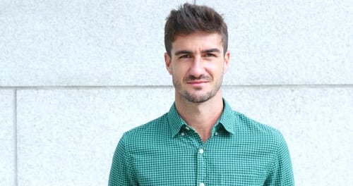 Smiling Man in Green Shirt Portrait
