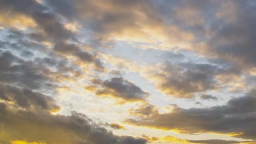 Dramatic Golden Sunset Clouds Over a City