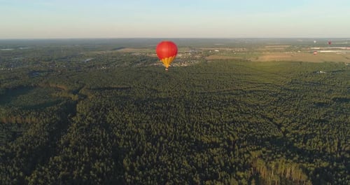 Hot Air Balloon Over Lush Green Forest, Aerial View
